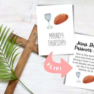 May include: Two white cards with a watercolor illustration of a glass of wine and a loaf of bread. The top card says "Maundy Thursday" and the bottom card says "Jesus Shares Passover Feast" with a Bible verse from Matthew 26:26. A pink arrow points from the top card to the bottom card with the word "Flip!" written on it.