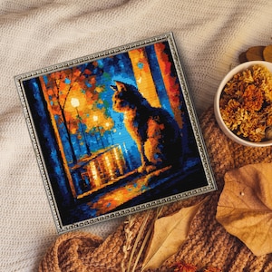 May include: Framed artwork featuring a cat silhouette gazing out a window at a park scene. The artwork uses a pointillism style with orange, blue, and yellow hues. The frame is silver and the artwork is displayed on a cozy, textured surface.