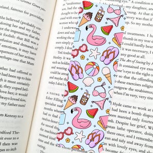 May include: A bookmark with a light blue background featuring a repeating pattern of summer-themed illustrations. The design includes pink flamingos, ice cream cones, watermelon slices, sunglasses, and flip-flops.