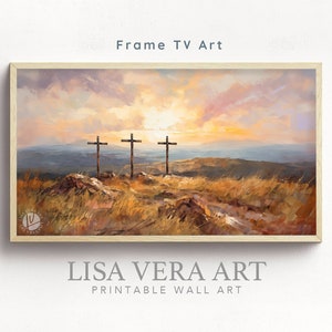 May include: A painting of three wooden crosses on a hilltop with a sunset in the background. The painting is framed in a light wood frame. The text "LISA VERA ART PRINTABLE WALL ART" is below the frame.