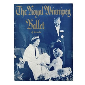 May include: A black and white photograph of a woman wearing a crown and a white dress, a man in a suit, and a young girl in a white dress. The photo is from a programme for The Royal Winnipeg Ballet of Canada.