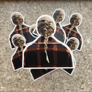 May include: A set of five stickers featuring a person with blonde hair in a braided ponytail, wearing a plaid shirt. The person is facing away from the viewer.