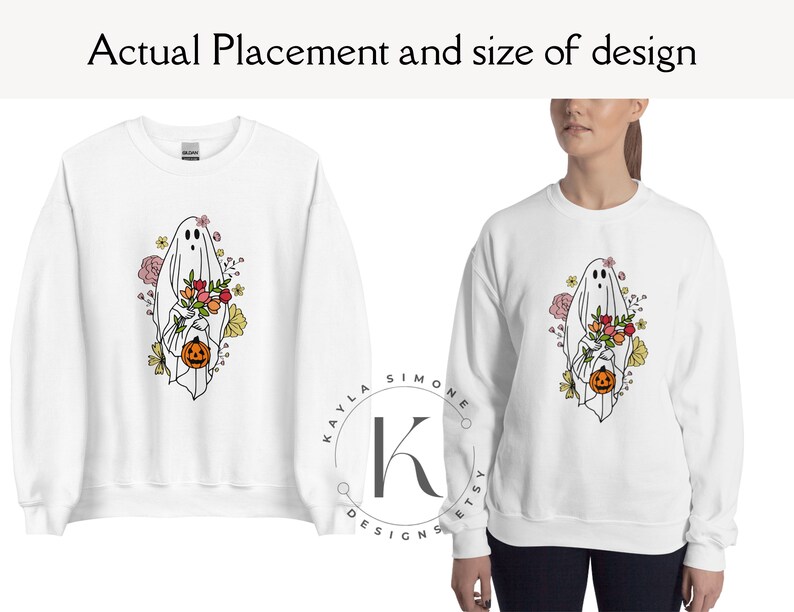 May include: White sweatshirt with a graphic of a ghost holding a pumpkin and flowers. The ghost is outlined in black and the flowers are in shades of pink, yellow, and orange. The text "KAYLA SIMONE ETSY DESIGNS" is printed on the bottom of the sweatshirt.