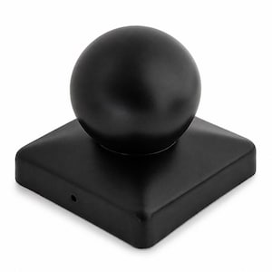 May include: A matte black post cap featuring a spherical finial centered on a square base. The base has rounded corners and a small circular hole visible on the front edge. The entire object has a smooth, uniform finish and a solid construction.