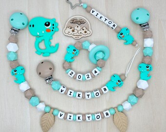 Babygeschenk Schnullerkette mit Name , kinderwagenkette, schlüsselanhänger und Greifling  aus silikon perlen Dino +  Ring adaptor gratis