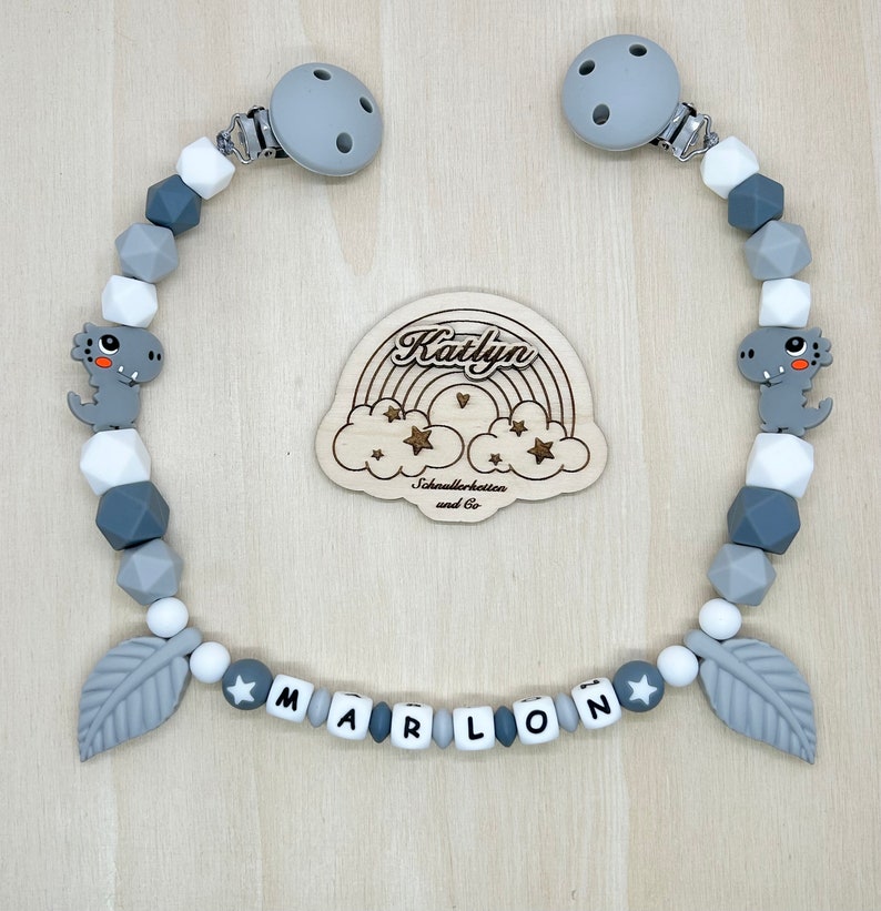 Babygeschenk Schnullerkette mit Name , kinderwagenkette, schlüsselanhänger und Greifling aus silikon perlen Dino Ring adaptor gratis Kinderwagenkette