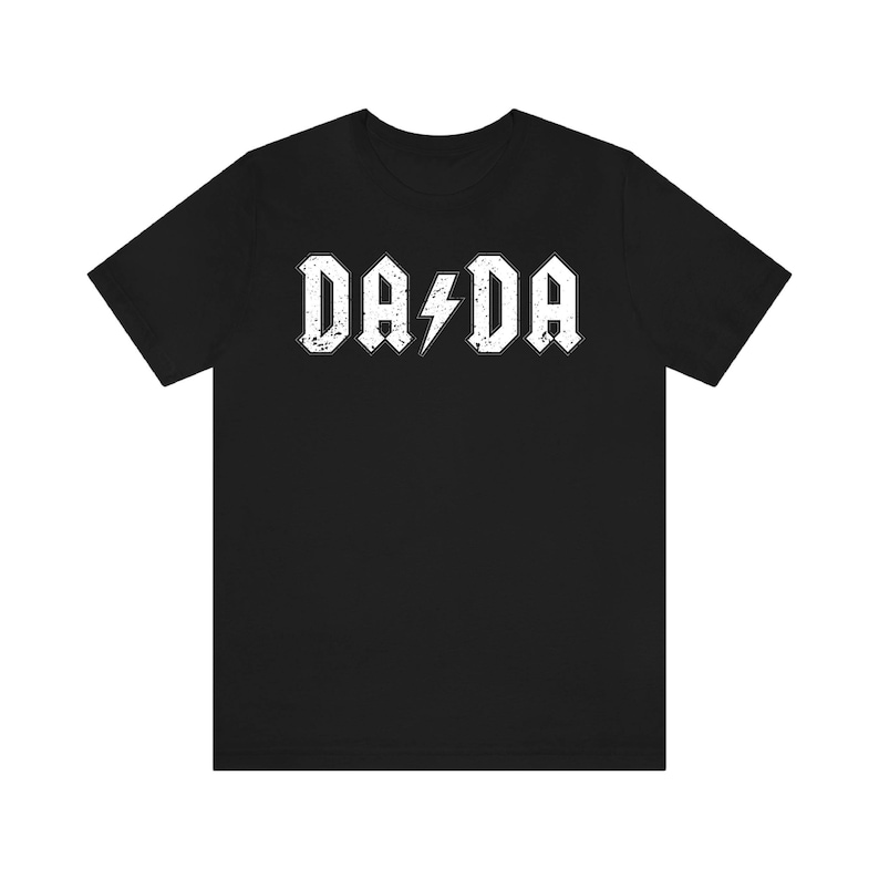 May include: Black t-shirt with a white graphic that says "DA DA" with a lightning bolt in between the words.