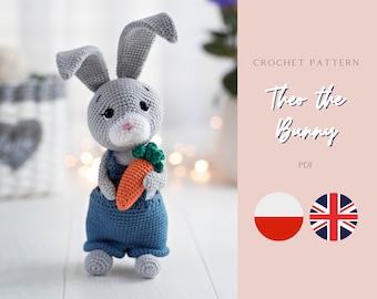 May include: Crochet pattern for Theo the Bunny, a grey crocheted bunny holding a carrot. The pattern is available in PDF format and includes instructions in both Polish and English.