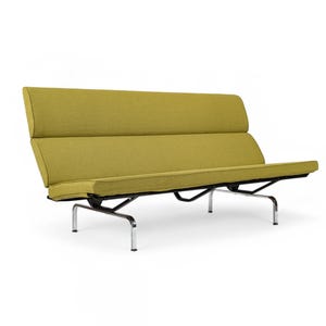 May include: A modern, two-seater sofa with a lime green fabric. The sofa has a low profile with a rectangular seat and backrest. The frame is black with chrome legs. The sofa is approximately 72 inches long.