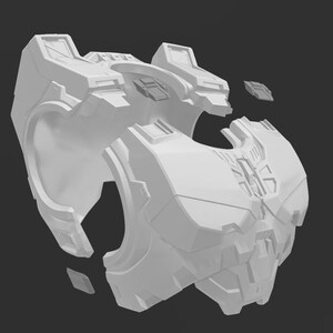 May include: A white plastic model of a futuristic chest piece armor, broken into multiple pieces. The armor has a detailed design with geometric shapes and a textured surface.