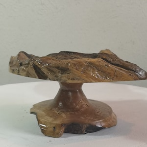 Small display stand or wine bottle holder in olive root