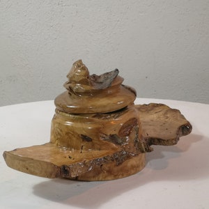 Covered rustic small dish in olive root