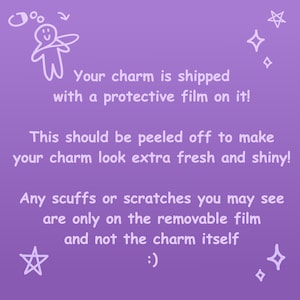 May include: A purple background with white text that reads: "Your charm is shipped with a protective film on it! This should be peeled off to make your charm look extra fresh and shiny!" and more.