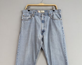 May include: Light blue denim jeans with a