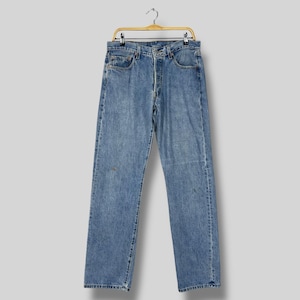 Vintage 2000s Levi’s 501 Jeans W32 L33 / Medium Washed Distressed Denim / Button Fly Straight Leg /  Y2K Irregular Stamp Size 32