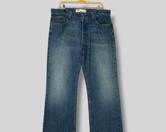 Jeans Levi’s 567 Loose Bootcut Vintage, talla W38 L30 / Tiro alto, mezclilla lavada media / Jeans estilo skater holgados con perneras acampanadas y efecto grunge desgastado, estilo Y2K
