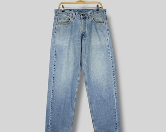 Vintage Levi’s 565 Loose Fit Wide Leg Jeans W33 L32 / High Rise Light Blue Wash Denim / Distressed Zipper Fly Boyfriend Jeans Size 33