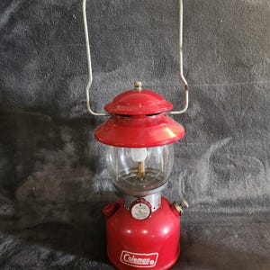 Vintage October 1967 Coleman Red lantern single mantel Model 200A with a Pyrex globe