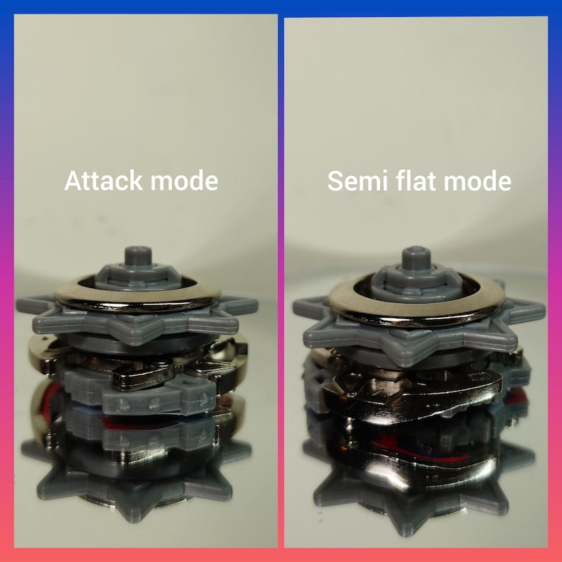 May include: Two gray and silver toy tops are shown in different modes. The left top is labeled "Attack mode" and the right top is labeled "Semi flat mode". The tops have a star-shaped design and a silver ring.