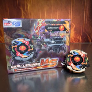 May include: A boxed Dark Leopard Metal Sweeper toy set with a matching toy. The box features a graphic of a purple creature with flames. The toy is black, orange, blue, and gold.