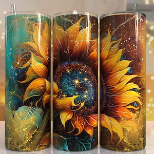 May include: Three stainless steel tumblers with a sunflower design. The sunflowers are painted in shades of yellow, orange, and brown with a teal and gold background. The tumblers are perfect for holding hot or cold beverages.