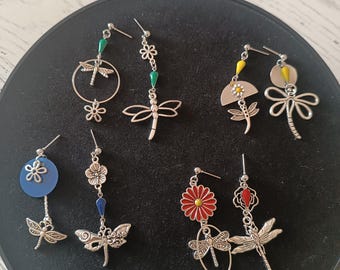Asymmetrical dragonfly and flower earrings.