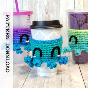 May include: Three crocheted octopus cup cozies in different color combinations. The cozies are teal, purple, and green with black eyes and pink cheeks. The cozies are on top of cups.
