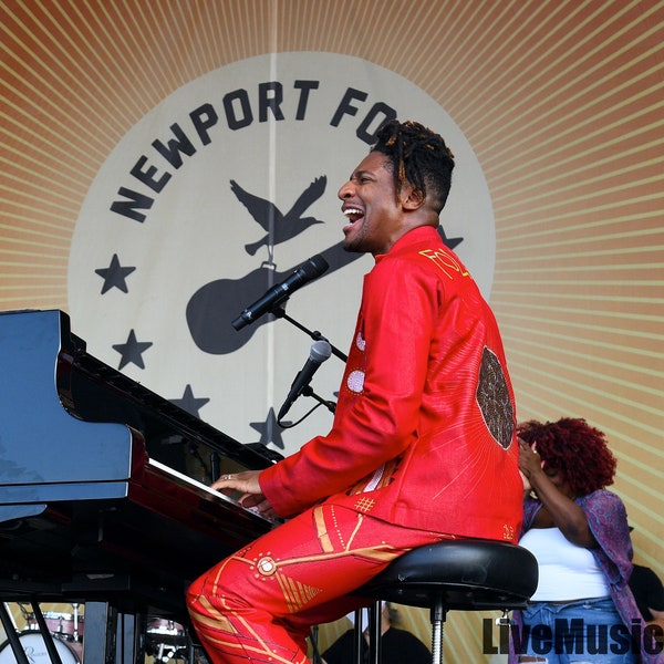 Limited Edition Glossy Print of Jon Batiste performing live.