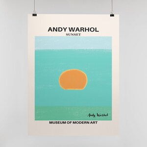 May include: A minimalist poster with a light blue, turquoise, and green color scheme. The poster features a large orange circle in the center, representing a sunset. The text "ANDY WARHOL SUNSET" is at the top of the poster, and the text "MUSEUM OF MODERN ART" is at the bottom. The artist's signature, "Andy Warhol", is in the lower right corner.