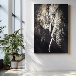 Peut inclure: Une photographie en noir et blanc en gros plan du visage d'un &eacute;l&eacute;phant. La trompe de l'&eacute;l&eacute;phant est enroul&eacute;e et son &oelig;il est visible. L'image est nette et la texture de la peau de l'&eacute;l&eacute;phant est visible.