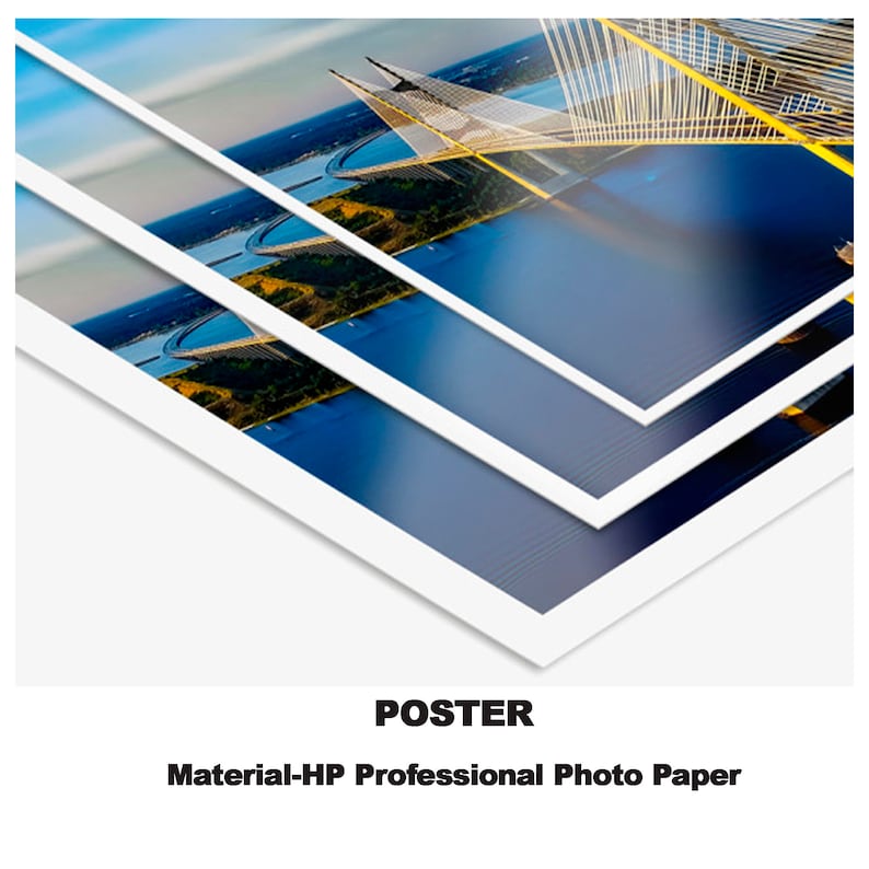 May include: A poster print of a bridge over water. The bridge is made of white metal and has a yellow support structure. The poster is printed on HP Professional Photo Paper.