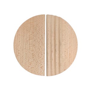 May include: Two wooden half-circle bookends. One bookend has a smooth, natural wood grain, while the other has vertical, ridged detailing. The bookends are light brown and sit against a white background.