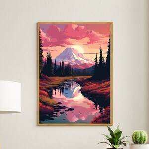 Può includere: Una stampa incorniciata di un paesaggio montano con un fiume che scorre attraverso di esso. Il cielo è di un rosa e un arancio vibranti, e la montagna è innevata. Il fiume riflette i colori del cielo.