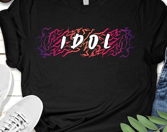 IDOL Graphic T-Shirt, Bold Text Over Patterned Background, Trendy Streetwear Tee, Music & Fashion Inspired Shirt