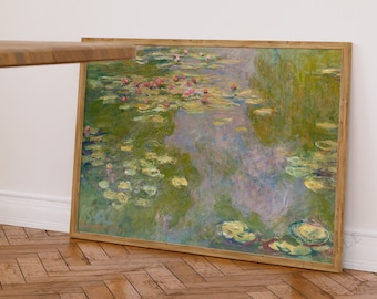 Puede incluir: Una pintura enmarcada de un estanque con nenúfares y hojas de nenúfares. El agua es de color azul verdoso claro y las hojas de nenúfares son verdes con algunas flores rosas. La pintura está en un marco de madera claro.