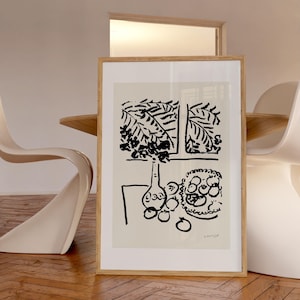May include: A black and white print of a still life featuring a vase with a leafy plant, a bowl of fruit, and the signature "H. Matisse".