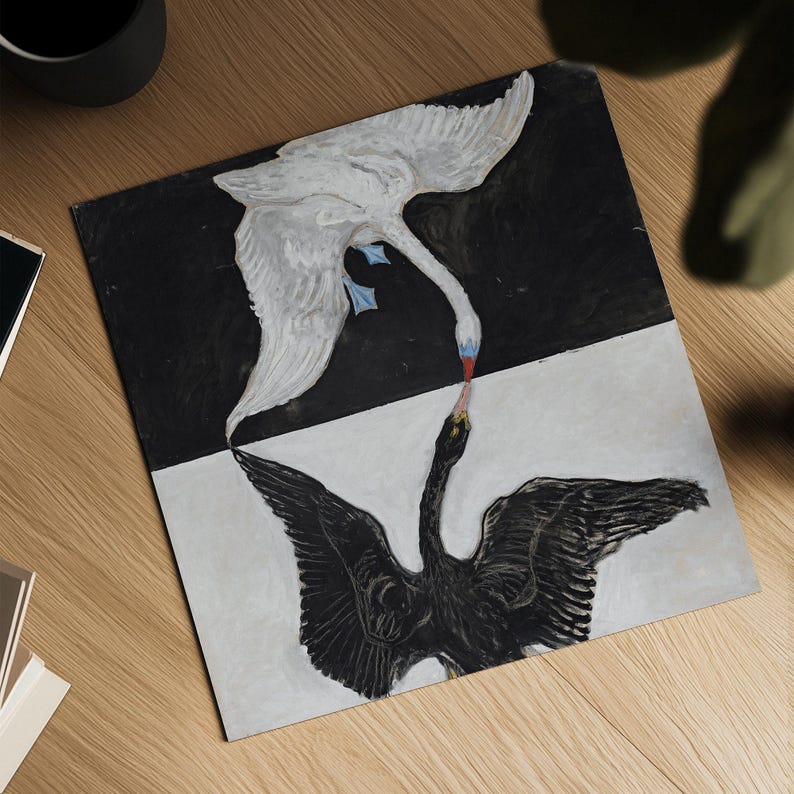 May include: A black and white painting of two birds, one white and one black, with their beaks touching. The white bird is flying upside down, and the black bird is facing up. The painting is on a canvas with a black and white background.