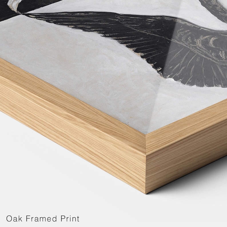 May include: A black and white framed print of a bird with its wings spread wide. The frame is made of natural oak wood.