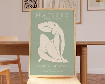May include: A green and white poster with the text "MATISSE" and "PAPIERS DECOUPES" in black. The poster also features a white silhouette of a person sitting with their head resting on their hand. The text "GALERIE MAEGH" is at the bottom of the poster.