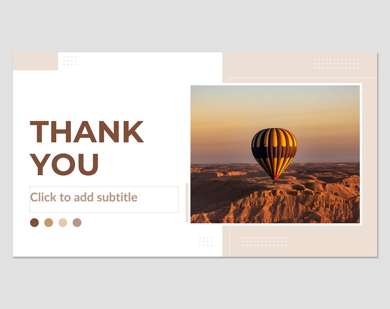 May include: A hot air balloon with yellow, blue, and black stripes floats over a desert landscape at sunset. The sky is a soft orange and pink. The text "THANK YOU" is in brown letters on a white background. The text "Click to add subtitle" is below the text "THANK YOU".