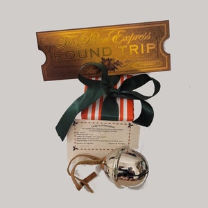 May include: A silver bell with a brown leather cord, a red and white striped box with a green ribbon, and a gold ticket that reads "The Polar Express Round Trip" with the number "N10001225".