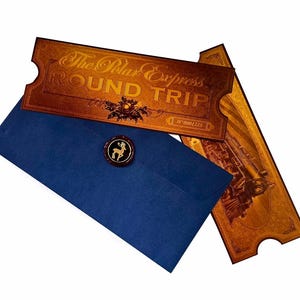 May include: A blue envelope with a wax seal and a gold ticket for a round trip on the Polar Express train. The ticket has the words "The Polar Express" and "Round Trip" printed on it.