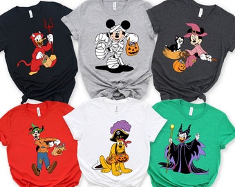 May include: Six different t-shirts featuring various Disney characters dressed in Halloween costumes. The shirts are all white, grey, black, red, green, and blue. The characters include Mickey Mouse, Pluto, Goofy, Donald Duck, and Maleficent.