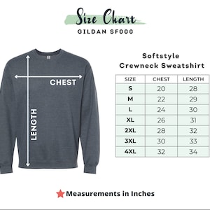 May include: A dark gray Softstyle crewneck sweatshirt with a size chart. The chart shows chest and length measurements in inches for sizes S to 4XL. The sweatshirt has a chest measurement of 20 inches for size S and 32 inches for size 4XL.