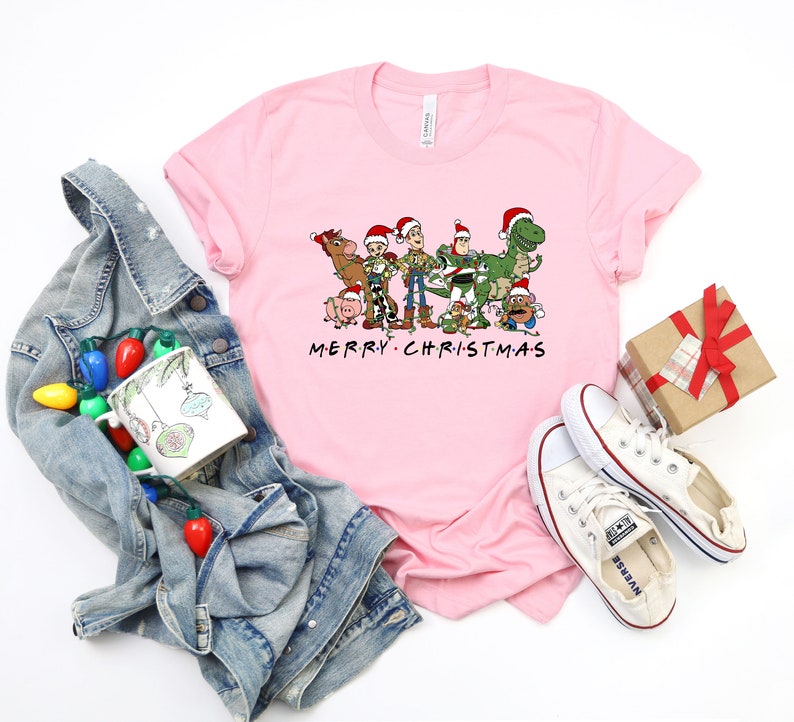 a pink t - shirt with the words merry christmas on it