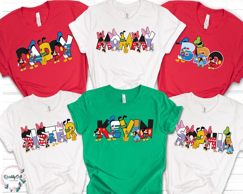 May include: A collection of colorful t-shirts featuring Disney characters and names. The shirts are red, white, and green, with names like "Daddy," "Mommy," "Bro," "Sister," "Kevin," and "Sophia" in a playful font, perfect for family or group wear.