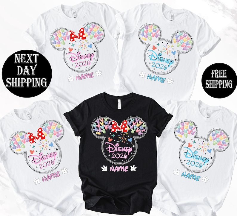 a collection of Disney-themed t-shirts, each featuring a unique design of a Mickey Mouse ear with colorful hearts and the text "Disney 2020". The t-shirts are arranged in a row, with the first one being a black t-shirt and the rest being white t-shirts. The text "Disney 2020" is prominently displayed on each t-shirt, indicating the theme of the shirts.