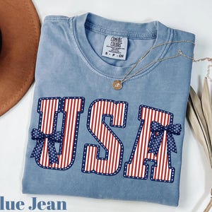 USA Flag Comfort Colors® Coquette Bow Shirt, 4th of July Coquette Bow shirt, America flag Shirt,Fourth of July Shirt,Patriotic Shirt,USA TEE