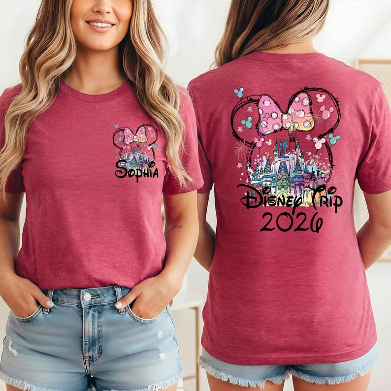 May include: A maroon t-shirt featuring a Minnie Mouse design with the text "Sophia" on the front. The back of the shirt displays a larger Minnie Mouse design with a castle and the text "Disney Trip 2026".