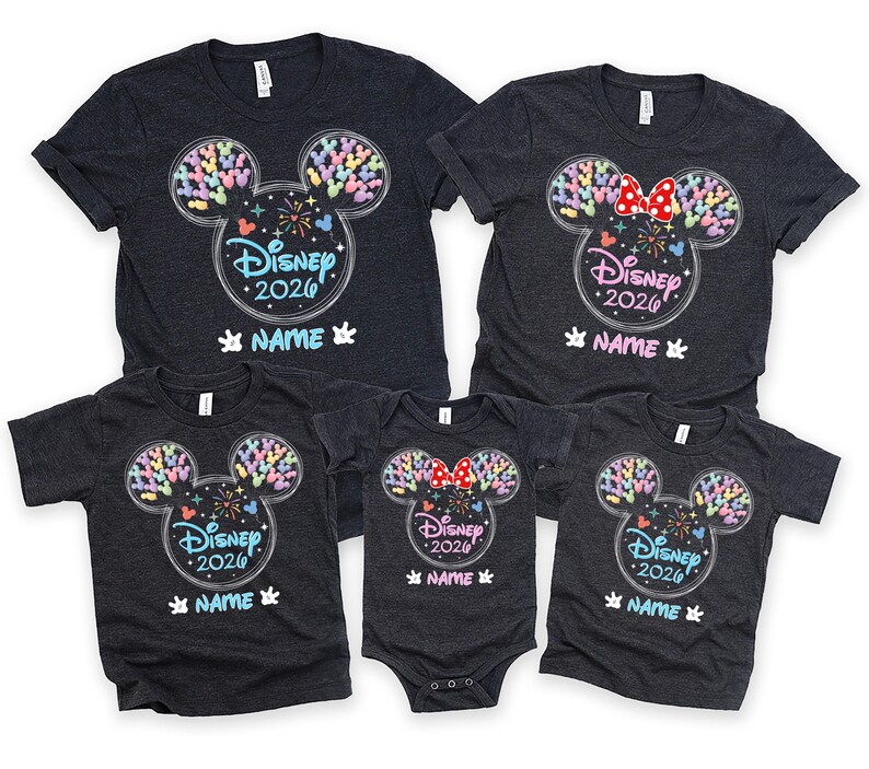 a collection of Disney-themed t-shirts, each featuring a unique design of Mickey Mouse ears and the text "Disney 2020" printed on them. The t-shirts are arranged in a row, showcasing various sizes and styles, likely intended for a family or group of Disney fans.